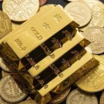 Prețul aurului, un nou RECORD în timp ce dolarul scade